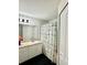 Bright bathroom featuring a vanity with white cabinetry and a shower with a decorative curtain at 4122 Central Sarasota Pkwy # 1923, Sarasota, FL 34238