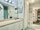 Bathroom with vanity, mirror, toilet, laundry access and linen closet at 4122 Central Sarasota Pkwy # 1923, Sarasota, FL 34238