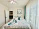 Bedroom with ceiling fan, natural lighting, and a painting on the wall at 4122 Central Sarasota Pkwy # 1923, Sarasota, FL 34238