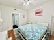Bedroom featuring bright natural light, ceiling fan, and decorative bedspread at 4122 Central Sarasota Pkwy # 1923, Sarasota, FL 34238