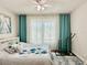 Bedroom featuring bright natural light, ceiling fan, and decorative bedspread at 4122 Central Sarasota Pkwy # 1923, Sarasota, FL 34238