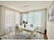 Chic dining area featuring a stylish chandelier and sheer curtains for an airy feel at 4122 Central Sarasota Pkwy # 1923, Sarasota, FL 34238