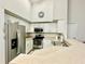 Bright kitchen with white cabinets, stainless steel appliances, and a breakfast bar at 4122 Central Sarasota Pkwy # 1923, Sarasota, FL 34238