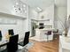 Modern kitchen with stainless steel appliances, breakfast bar, and a dining area featuring a stylish chandelier at 4122 Central Sarasota Pkwy # 1923, Sarasota, FL 34238