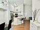 Modern kitchen with stainless steel appliances, breakfast bar, and a dining area featuring a stylish chandelier at 4122 Central Sarasota Pkwy # 1923, Sarasota, FL 34238