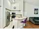 Bright kitchen with white cabinets, stainless steel appliances, and a breakfast bar with seating at 4122 Central Sarasota Pkwy # 1923, Sarasota, FL 34238