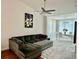 Open-concept living room and dining area with large sectional sofa at 4122 Central Sarasota Pkwy # 1923, Sarasota, FL 34238