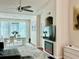 Stylish living room with modern furnishings and open floor plan to the dining area at 4122 Central Sarasota Pkwy # 1923, Sarasota, FL 34238