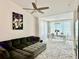 Cozy living room with a large sectional sofa and view of the dining area at 4122 Central Sarasota Pkwy # 1923, Sarasota, FL 34238