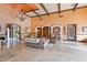 Elegant living room with decorative columns, a chandelier, and travertine floors, showcasing luxury at 4122 Central Sarasota Pkwy # 1923, Sarasota, FL 34238