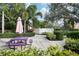 Outdoor picnic area featuring a purple picnic table and well-maintained landscaping, ideal for gatherings at 4122 Central Sarasota Pkwy # 1923, Sarasota, FL 34238