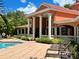 A resort style community pool with deck chairs, well maintained grounds and a spa at 4122 Central Sarasota Pkwy # 1923, Sarasota, FL 34238