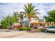 Charming pizzeria storefront with colorful murals, shaded patio, and inviting curb appeal in a beach town at 4122 Central Sarasota Pkwy # 1923, Sarasota, FL 34238