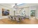 Elegant dining room featuring a large table and expansive views through bright, sunlit windows at 4123 Bay Shore Rd, Sarasota, FL 34234