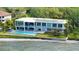 Modern home with infinity pool, beach access, solar panels, and outdoor entertaining spaces at 4123 Bay Shore Rd, Sarasota, FL 34234
