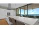 Contemporary kitchen with a large island, stainless steel appliances, and sliding glass doors to the balcony at 4123 Bay Shore Rd, Sarasota, FL 34234