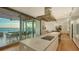 Open-concept kitchen leading to a spacious deck with ocean views, perfect for entertaining at 4123 Bay Shore Rd, Sarasota, FL 34234