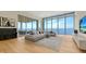 Open living room with floor to ceiling windows providing stunning waterfront views at 4123 Bay Shore Rd, Sarasota, FL 34234