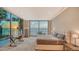 Bright main bedroom with floor-to-ceiling windows offering beautiful sunset and ocean views at 4123 Bay Shore Rd, Sarasota, FL 34234