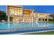 Luxury waterfront home featuring an inviting pool with comfortable outdoor seating at 4123 Bay Shore Rd, Sarasota, FL 34234