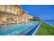 Beautiful waterfront pool and patio area with stunning views and ample seating at 4123 Bay Shore Rd, Sarasota, FL 34234