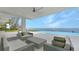 Inviting pool area featuring comfortable lounge seating and ocean views at 4123 Bay Shore Rd, Sarasota, FL 34234