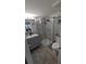 Updated bathroom features a stand-up shower and grey vanity at 4158 Tamiami Trl # V1, Port Charlotte, FL 33952