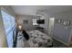 Bedroom with wood laminate flooring, natural light and ceiling fan at 4158 Tamiami Trl # V1, Port Charlotte, FL 33952