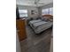 Bedroom featuring natural light, closet, and laminate flooring at 4158 Tamiami Trl # V1, Port Charlotte, FL 33952