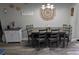 Cozy dining room features a modern table, chairs and decor to complete the warm atmosphere at 4158 Tamiami Trl # V1, Port Charlotte, FL 33952