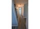 Hallway with laminate flooring and closet at 4158 Tamiami Trl # V1, Port Charlotte, FL 33952