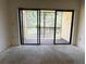 View from interior room out to screened balcony overlooking a pond at 425 30Th W Ave # C204, Bradenton, FL 34205