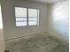 Bedroom featuring a window providing ample natural light at 425 30Th W Ave # C204, Bradenton, FL 34205