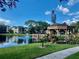 Picturesque gazebo overlooking a pond with a fountain, embraced by lush greenery and condo buildings at 425 30Th W Ave # C204, Bradenton, FL 34205