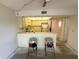Open kitchen layout adjoining dining area, ready for renovation at 425 30Th W Ave # C204, Bradenton, FL 34205