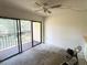 Living room with sliding doors to balcony; ready for renovation at 425 30Th W Ave # C204, Bradenton, FL 34205