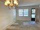 Living room with bright lighting and an entry doorway to the outside at 425 30Th W Ave # C204, Bradenton, FL 34205