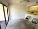 Open-concept space connects to kitchen and balcony; ready for renovation at 425 30Th W Ave # C204, Bradenton, FL 34205