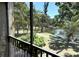 Balcony view of a picturesque pond with fountain and landscaping at 425 30Th W Ave # C204, Bradenton, FL 34205
