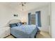 Cozy bedroom with a ceiling fan, a comfortable bed, and lots of natural light at 4519 14Th E St, Ellenton, FL 34222