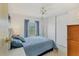 Bedroom with ceiling fan, closet and natural light creates a cozy and inviting atmosphere at 4519 14Th E St, Ellenton, FL 34222