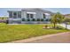 Well-manicured lawn with tidy shrubbery in front of a light blue single-story home at 4519 14Th E St, Ellenton, FL 34222