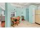 Quaint eat-in kitchen with tile floors and a pass-through window to the living area at 4519 14Th E St, Ellenton, FL 34222