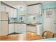 Functional kitchen with white cabinets, laminate counters, and essential appliances at 4519 14Th E St, Ellenton, FL 34222