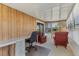 Bright sunroom offering a relaxing space with ample seating and sliding door access to the outside at 4519 14Th E St, Ellenton, FL 34222