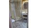 Bathroom with standing shower, toilet, sink and neutral colors at 4700 Neptune Rd, Venice, FL 34293