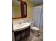 Bathroom featuring a vanity and toilet, with a tiled shower/tub combo at 4700 Neptune Rd, Venice, FL 34293