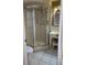 Bathroom with a walk-in shower, vanity with storage, tile flooring and a decorative light fixture at 4700 Neptune Rd, Venice, FL 34293