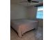 Bedroom featuring white tile flooring, ceiling fan, and window with natural light at 4700 Neptune Rd, Venice, FL 34293
