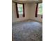Bedroom with natural light, showing two windows at 4700 Neptune Rd, Venice, FL 34293